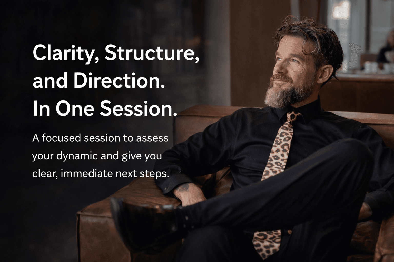 Man seated in leather chair in a calm, upscale setting, representing clarity and grounded relationship coaching by Sir Christopher